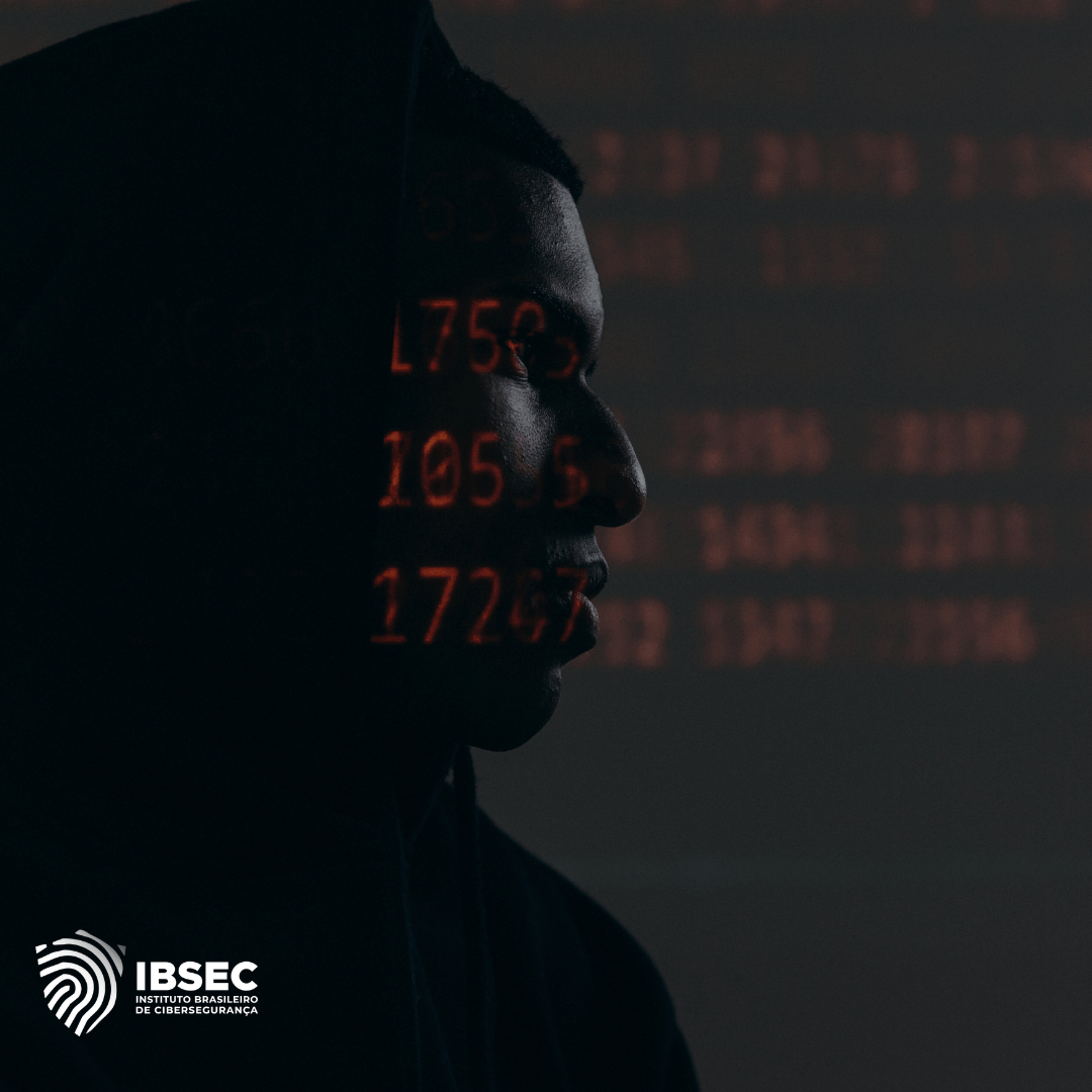 A imagem mostra o perfil de uma pessoa, parcialmente envolta em sombras, com uma projeção de números vermelhos na face e no fundo. O logotipo do IBSEC (Instituto Brasileiro de Cibersegurança) está localizado no canto inferior esquerdo da imagem. A cena transmite uma sensação de vigilância cibernética e segurança digital.