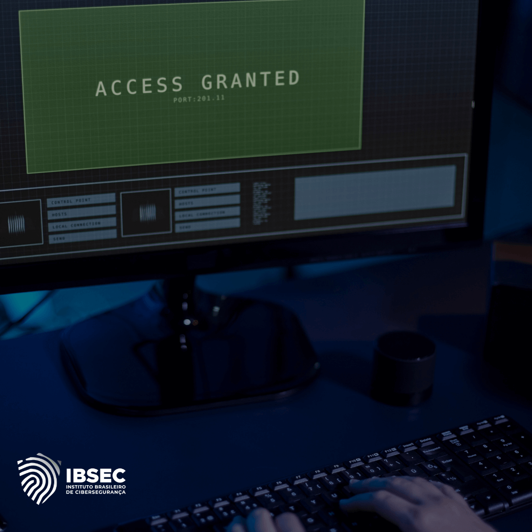 Imagem de um monitor de computador exibindo a mensagem "Access Granted" (Acesso Concedido) sobre um fundo verde, indicando que o acesso foi permitido em uma conexão na porta 201.11. A cena está ambientada em um espaço com pouca iluminação, com mãos de uma pessoa digitando no teclado em primeiro plano. No canto inferior esquerdo, o logotipo do Instituto Brasileiro de Cibersegurança (IBSEC) é visível. A imagem sugere atividades relacionadas a testes de segurança ou simulações de acesso a sistemas em um ambiente de cibersegurança.